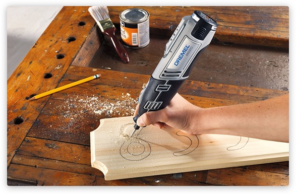 Person using Dremel to engrave